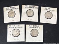 Five nickel coins in individual labeled white cardboard holders: 1945-P, 1945-S, 1944-D, 1943-S Jefferson wartime nickels and 1907 Liberty Head nickel.