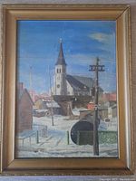 Full frontal view of painting in gilt wood frame showing cathedral and snow scene