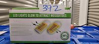 Photo of packaging showing a 6 pack of LED lights that glow to attract mosquitoes with product features and a mosquito graphic.