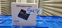Box of USB HDMI capture card with product image and text showing HDMI and 4K support.