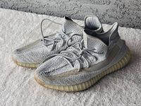 Pair of sneakers angled to show outer profiles