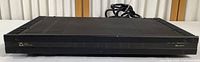 Front view of the Elan Z660 power amplifier showing the black metal case with ventilation slots and minimal front panel markings including model indication.