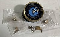 Overall lot view showing clock and five pins