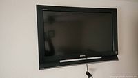 Front view of the Sony BRAVIA TV mounted on the wall showing the screen and logo