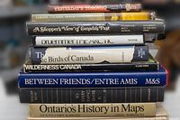 Stack of 10 Canadiana reference books showing titles and condition of dust jackets.