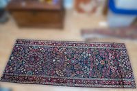 Full view of handwoven wool runner rug laid flat on floor