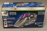Front view of unopened Bissell Little Green Pet Stain Eraser box showing brand, model, and product features including cordless convenience and pet stain removal.