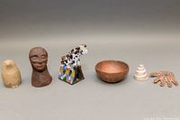 Full view of all six items in the lot arranged in a row showing variety and scale