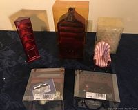 Full set of six cherrywood dollhouse furniture pieces arranged with two pink shell chairs in front and other pieces behind, all on a dark fabric surface.