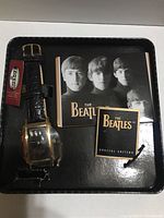 Special edition Fossil watch in original black metal box with The Beatles collector cards and booklet.