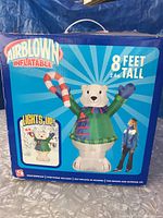 Photo of original packaging box showing Airblown Inflatable branding, 8 feet tall, lights up, and image of polar bear decoration with candy cane and person for scale.