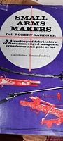 Front cover of the book titled 'Small Arms Makers' by Col. Robert Gardner, mentioning it is a directory of fabricators of firearms, edged weapons, crossbows, and pole arms.