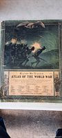 Full cover of Rand McNally Atlas of the World War showing graphic soldier battle scene and eagle emblem, title and table of contents.