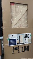 Sealed cardboard packaging showing Renin box containing sliding barn door kit