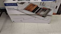 Closed box labeled Moorefield Francois Kitchen Sink Workstation