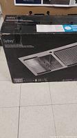 Front of original box showing product image and model name