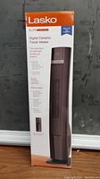 Full view of Lasko Elite Digital Ceramic Tower Heater in original packaging showing brand and product image.