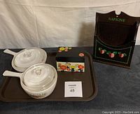 Full lot showing two CorningWare casseroles with lids, Ohio Art recipe card box, and Sears Warner wooden napkin holder on tray.