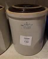 Front view of the stoneware crock showing the Blue Crown 3 gallons USA logo and the MaxSold tag 130.