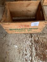 Top-down view of empty wooden crate showing natural wood interior and wear marks