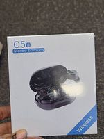 Box showing image of C5s stereo earbuds and charging case with wireless branding.