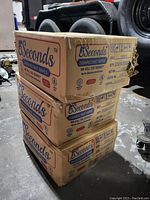 Three stacked cardboard boxes labeled '5Seconds Disinfectant Wipes' with some exterior wear.