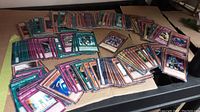 Wide view of the Yugioh trading cards spread out, showing a variety of spell, trap, and monster cards.