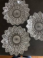 Top view of three Federal Glass petal pattern carnival glass salad bowls showing petal embossed design and scalloped edges.
