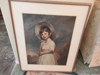 Full view of the framed artwork showing the full portrait and frame.