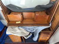 Front view of roll-top desk interior with removable organizer chest and base drawers
