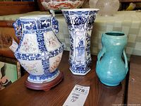 Three vases on display from front