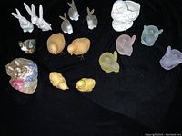 Overview photo of full lot showing all figurines together on a black backdrop.