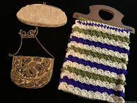 Three vintage purses displayed on a surface, showing front views with different materials and styles.