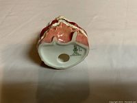 Photo of base showing Royal Doulton markings and model number 2038.