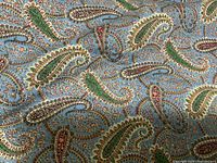 Close-up of the paisley side of the quilt showing intricate patterns and colors.
