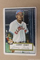 Front of 1952 Larry Doby baseball card showing player image, name, and signature box with wear on corners and edges.