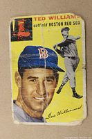 Front of the 1954 Ted Williams Topps baseball card showing portrait and batting image with creases and wear.