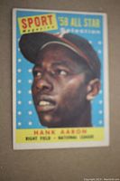Front of the 1958 Topps Hank Aaron All Star card showing close-up color portrait of Hank Aaron in Milwaukee Braves cap.