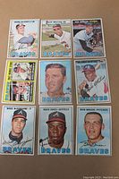 Photo showing front of nine 1967 Topps Atlanta Braves baseball cards arranged in a 3x3 grid including cards of Gene Oliver, Felix Millan, Ken Johnson, Clete Boyer, Orlando Martinez, Wade Blasingame, Mack Jones, and Bob Bruce.