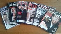 Photo showing six Musician magazines from 1988 with covers featuring U2, George Harrison, ZZ Top, John Coltrane, and the 100th issue.