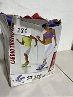 Original box showing exercise imagery and model ST 320 with visible wear and damage to box top opening.