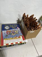 United States 50 State Coin Collector's Map and box of rolled coin wrappers