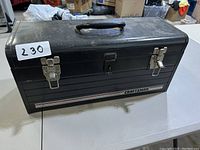 Exterior view of the black metal Craftsman tool box showing handle and locking latches.