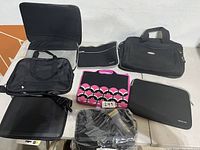 Photo showing the full set of six laptop cases in various styles and colors, arranged on a table.