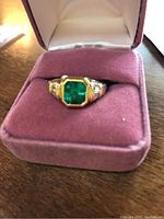 Front view of the ring in a pink velvet ring box