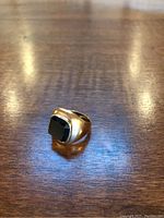 Angled top-down view of ring on wood surface