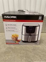 Box front showing product image and key features such as healthier cooking, 7 QT capacity, and easy to clean basket and tray.