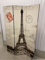 Front side featuring Eiffel Tower in vintage postcard style with written script and postal markings.