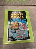 Front cover displaying colorful Mickey Mouse artwork and title 'Trader Mickey'