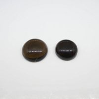 Two brown round cabochon smokey quartz gemstones on white background showing front top and side angles.